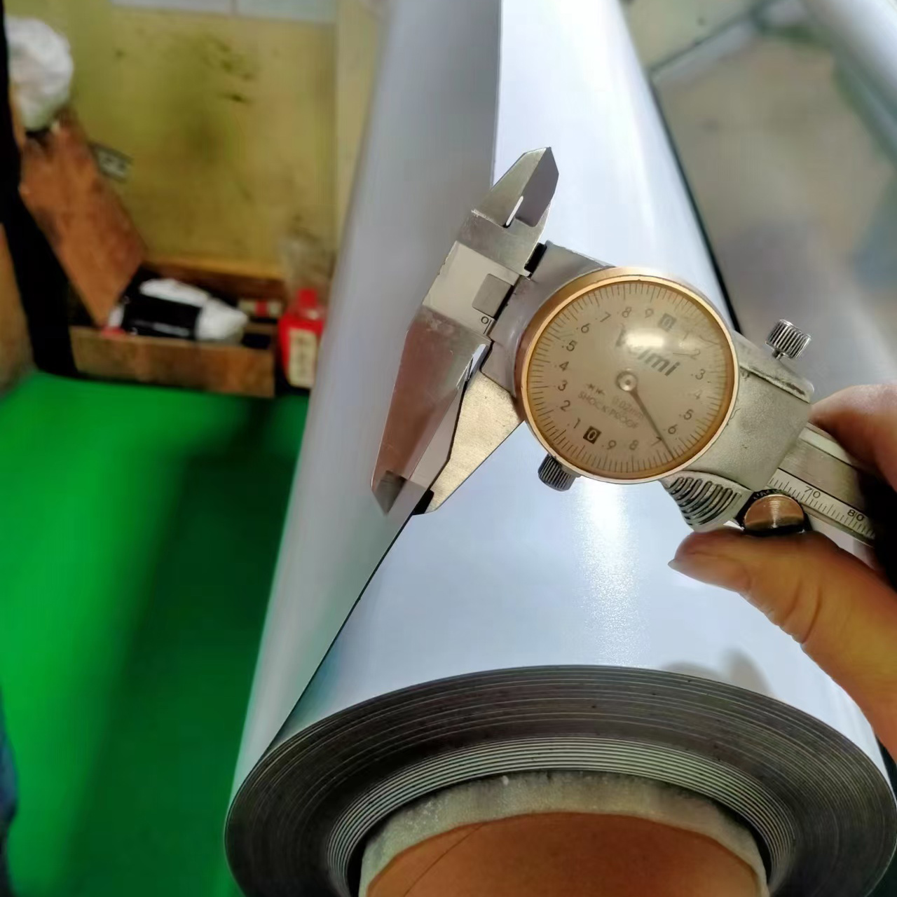 Dial caliper thickness check during quality control