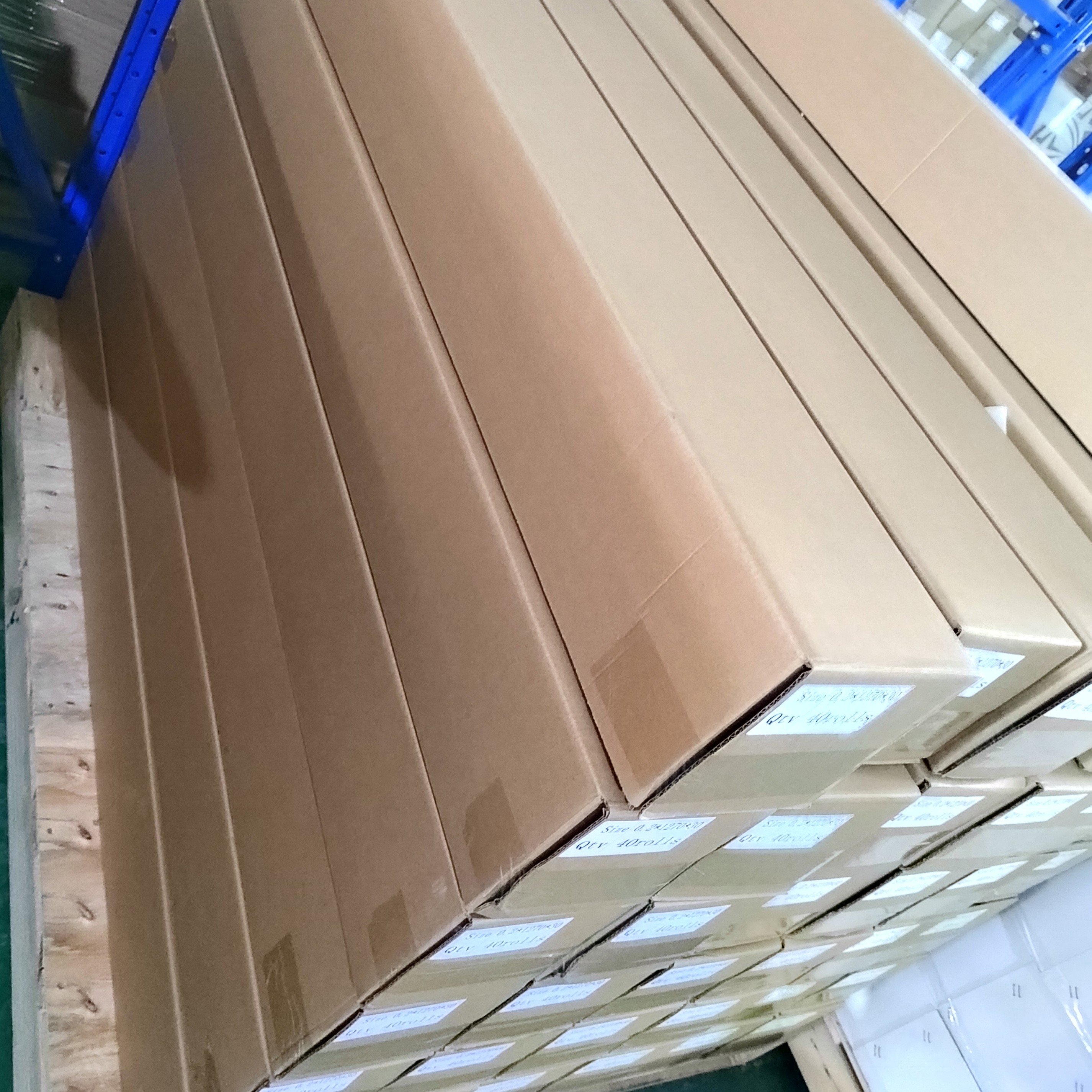 Ferrous PET film rolls packed in cartons on pallets, ready for dispatch