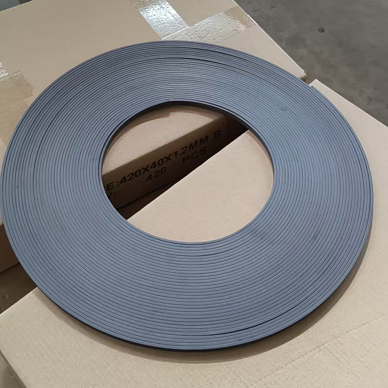 Coil of grey rubber magnet strip 420 x 40 x 1.2 mm